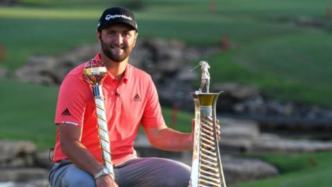 Jon Rahm with the Race to Dubai trophy in 2019