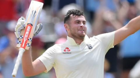 England opener Dom Sibley raises his bat to celebrate his maiden Test century against South Africa on day four of the second Test