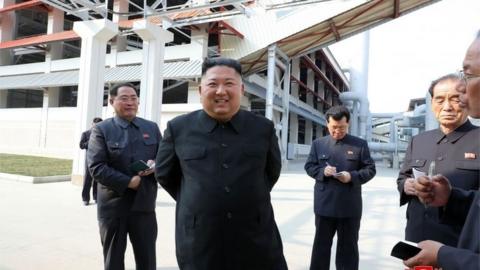 Kim Jong-un pictured by state media opening a fertiliser factory 1 May 2020