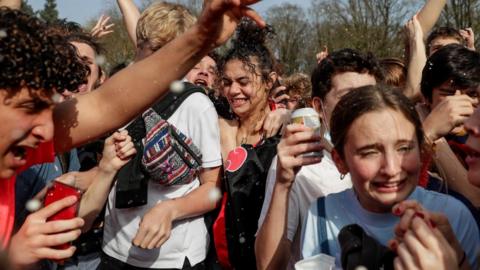 People take part in fake festival called "La Boum" organized by an anonymous group of people on Facebook for an April 1 joke at the "Bois de la Cambre, in Brussels, Belgium, 01 April 202