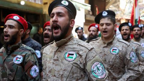 File photo showing members of the Popular Front for the Liberation of Palestine-General Command (PFLP-GC) marching during a parade in Burj al-Barajneh Palestinian refugee camp in Beirut, Lebanon (14 April 2023)