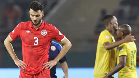 Montassar Talbi reacts following Tunisia's exit from the 2023 Africa Cup of Nations