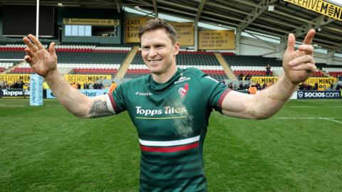 Leicester Tigers winger Chris Ashton celebrates after scoring a hat-trick to take his Premiership try tally to 101