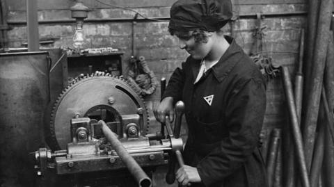 A woman at work in a shipbuilding yard