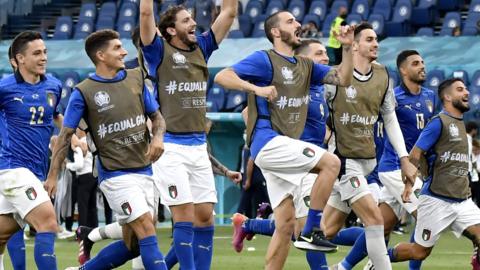 Italy players celebrate their win over Wales