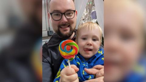 Christopher Eisenstadt and his three-year-old son, Harvey.