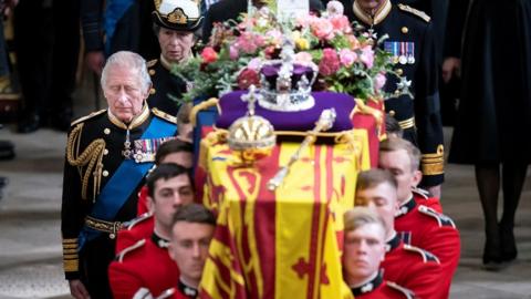 King Charles III follows the coffin of Queen Elizabeth III