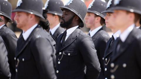 Newly qualified Metropolitan police officers take part in their Passing out Parade