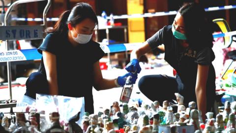 Police officers examine forensic evidence at the campus of the Polytechnic University (PolyU) in Hong Kong, China, November 28