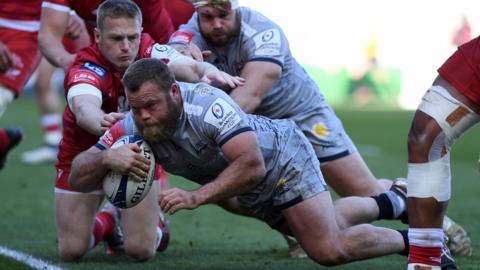 Akker van der Merwe of Sale Sharks scores his side's first try during the Heineken Champions Cup round of 16 match at Scarlets