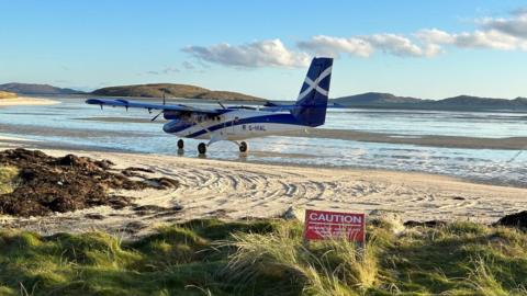 Winter break in the Outer Hebrides. Beautiful winter morning in Barra watching the Glasgow to Barra flight arrive on the beach runway.