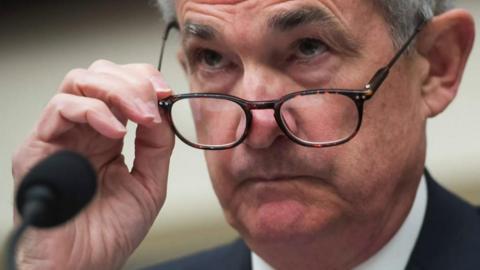 Jerome Powell looking over his glasses