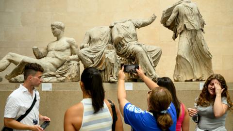 Visitors to the British Museum walk around a selection of items from the collection of ancient Greek sculptures known as The Elgin Marbles on 23 August 2023 in London, England