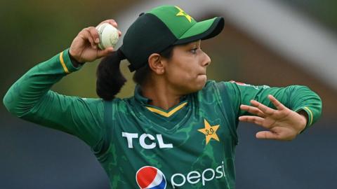 Fatima Sana throws the ball in from the boundary