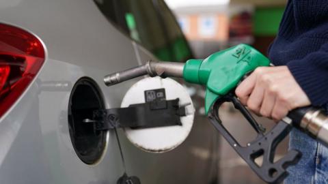 Man filling car from petrol pump