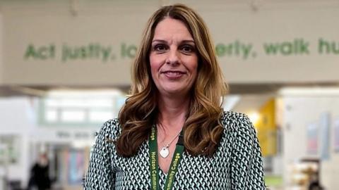 Claire Huddart stood in school foyer