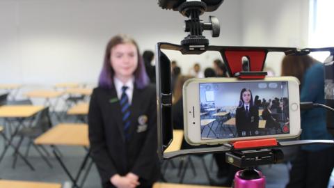 Girl being filmed on a smartphone