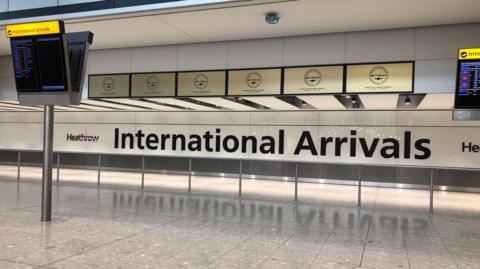 An empty International arrivals area at Heathrow Airport's Terminal 5