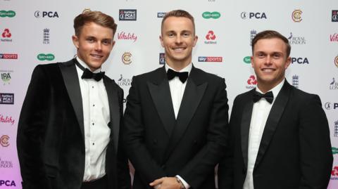 Sam, Tom and Ben Curran wearing tuxedos at the PCA awards