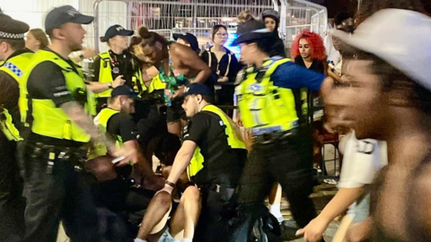 Police detaining a person in Southend-on-Sea