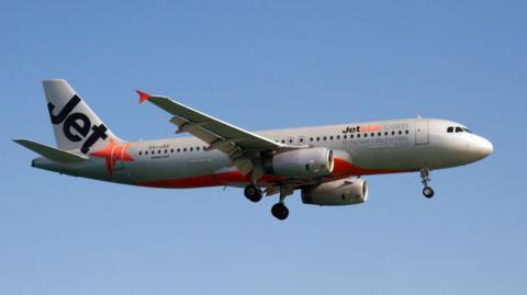 A Jetstar Asia Airways Airbus 320 lands at Phuket airport. 