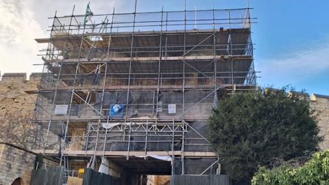 Scaffolding around one of the gates to Lincoln Castle