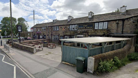 View of the White Swan pub in Wibsey from the road