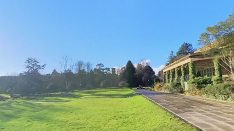 Screenshot from Google Maps of Valley Gardens, showing the pavilion building and patio, with grass in front