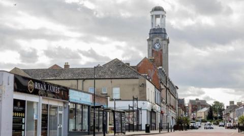 Spennymoor town centre with businesses including an estate agent in the foreground