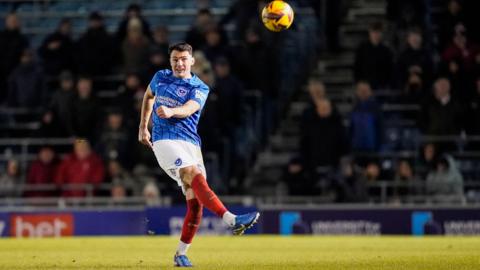 Portsmouth's Regan Poole kicking the ball