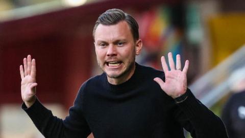Motherwell boss Alfred Johansson raises his hands