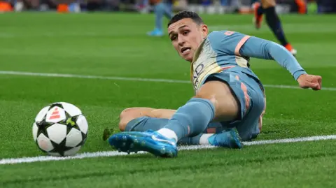 Phil Foden slides for ball