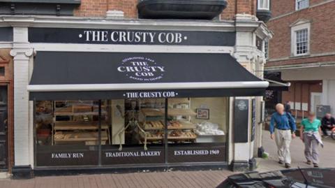 A street view image of the Crusty Cob bakery.