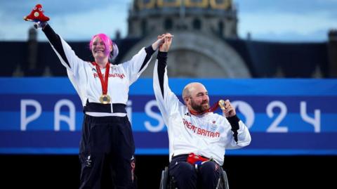 Jodie Grinham and Nathan Macqueen celebrate with their medals