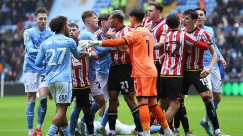 Coventry and Sheffield United players confront one another