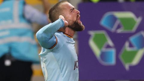 Bradford's Alex Pattison celebrates his equaliser at Rotherham by cupping his ear