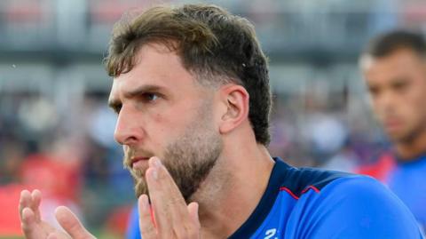 Josh Rourke applauds the Wakefield Trinity fans at the match against Hull KR in June
