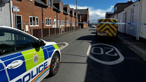 Police car and van at the scene on Lily Street on Thursday morning