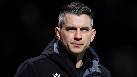 Oxford United boss Matt Bloomfield looks on at a game