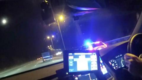 Dashcam footage shows a police car pushing a van.