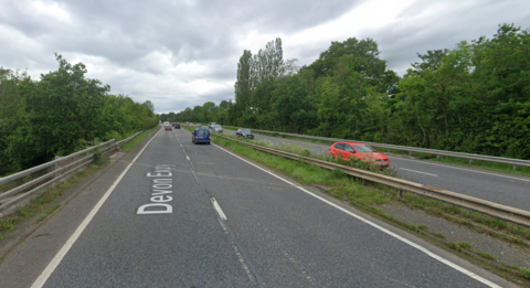 A portion of the A38, with some cars on both sides of the carriageway