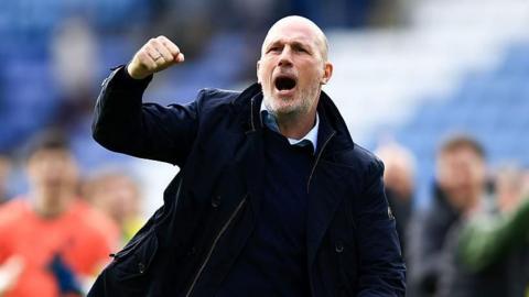 Norwich City head coach Philippe Clement celebrates with fans after winning at Leicester City.