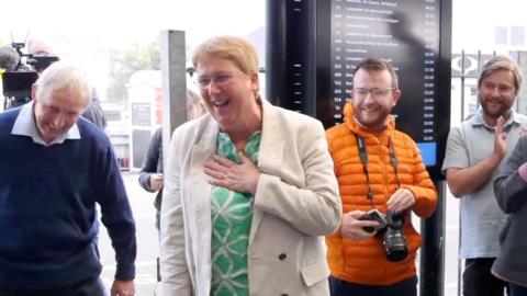 New MP holds her hand on her heart as she's serenaded