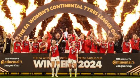 Arsenal lift the League Cup trophy