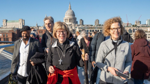 The Archbishop of Canterbury Dame Sarah Mullally, on the Millennium Bridge after setting off from St Paul's Cathedral at the start of her 87-mile pilgrimage from London to Canterbury Cathedral, ahead of her formal enthronement as the top bishop in the Church of England.