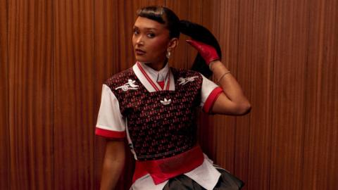Singer Joy Crookes models a new Adidas cropped shirt bearing the Arsenal logo. 