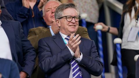 Andrew Cullen applauds the players at Fratton Park