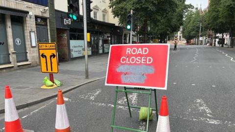 Road closure sign on an empty Upper Parliament Street