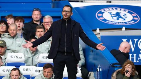 Liam Rosenior opens his arm wide while asking for a decision against Port Vale