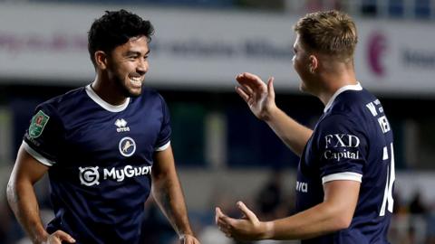 Massimo Luongo of Millwall celebrates scoring a goal with team-mate Daniel Kelly